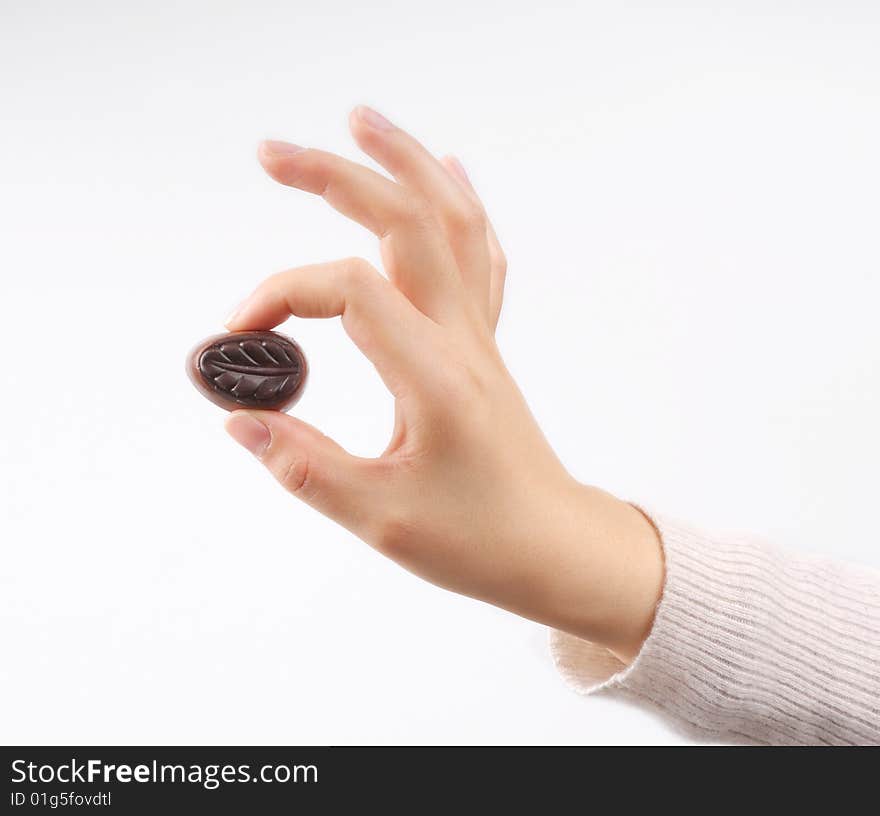 Take a chocolate. isolated on white.