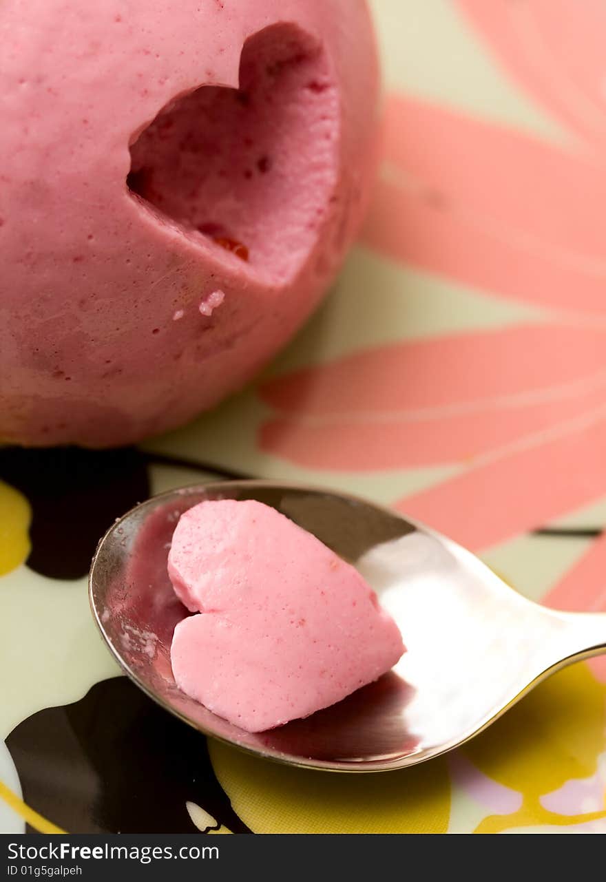 Delicious sweet pink dessert and spoon. Delicious sweet pink dessert and spoon