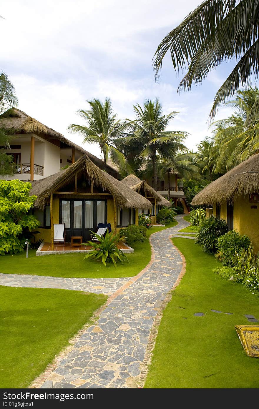 Bungalows of tropical beach resort at sunny day