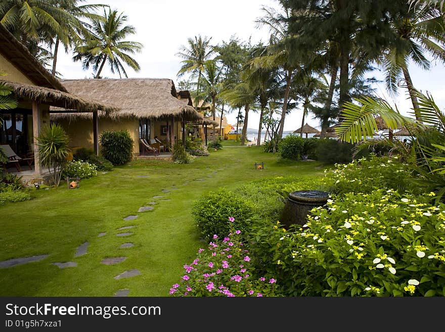 Bungalows of tropical beach resort at sunny day