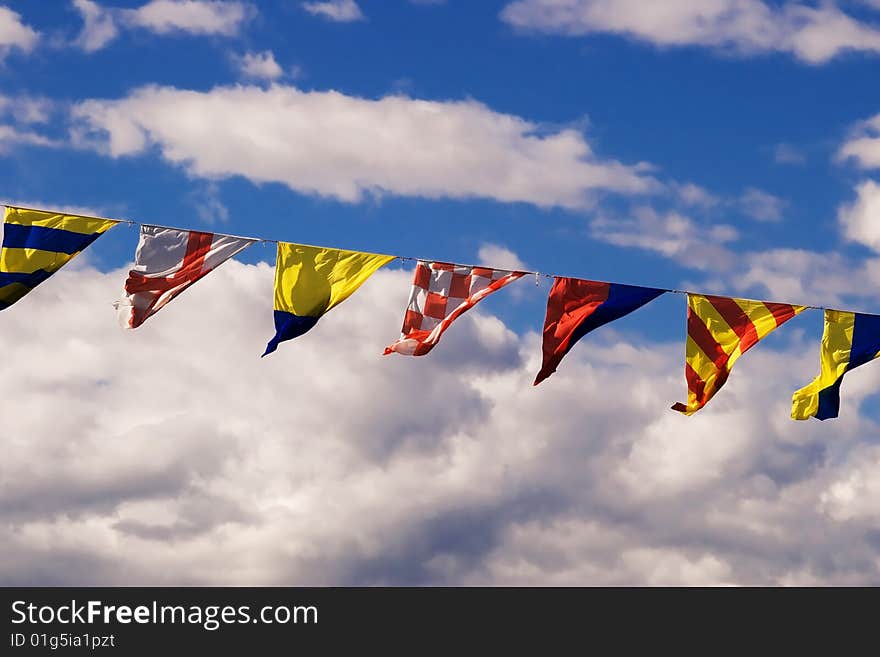 Naval flags on a cloudy sky background