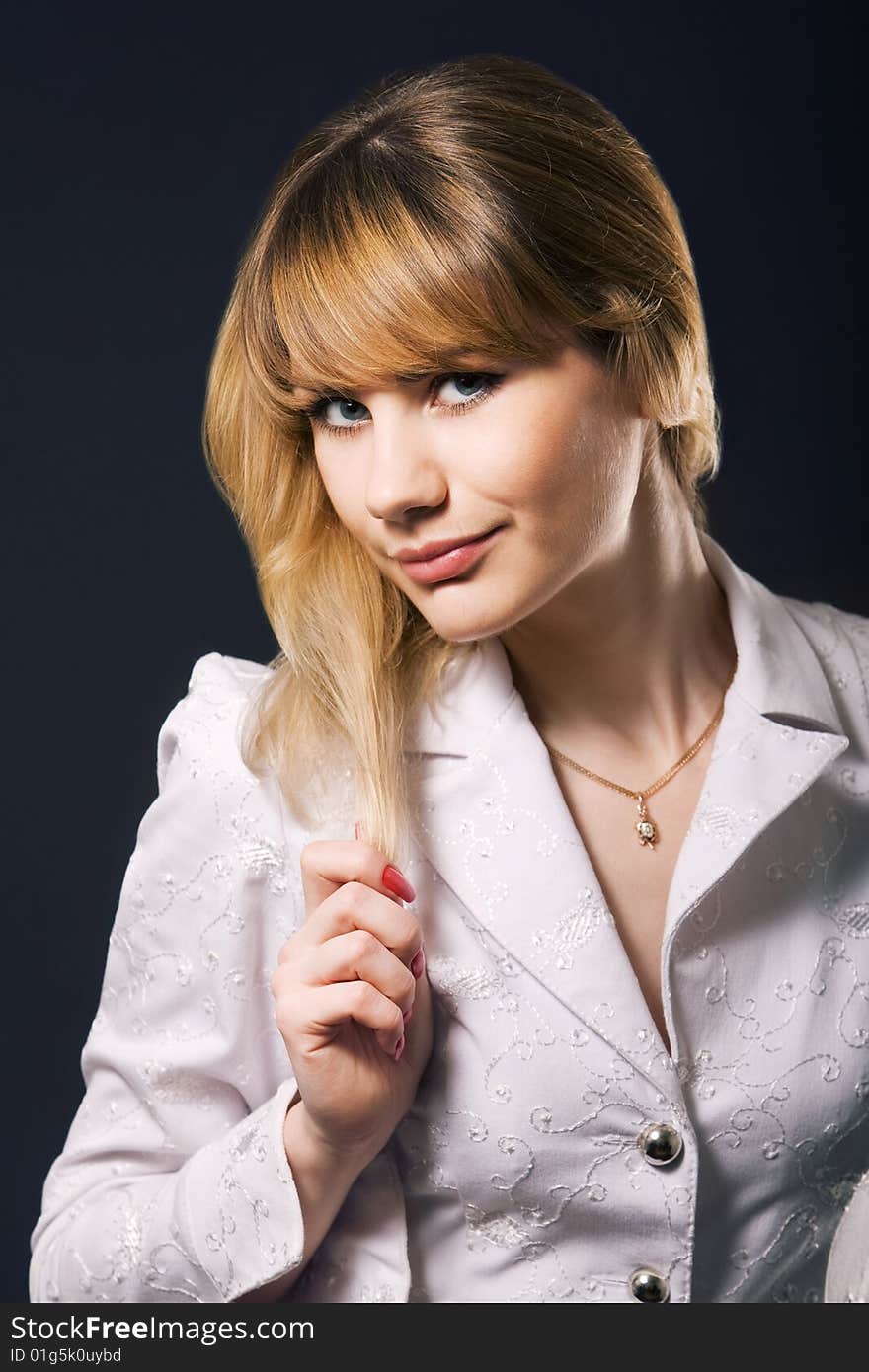 Portrait of beautiful young woman holding hair. Portrait of beautiful young woman holding hair