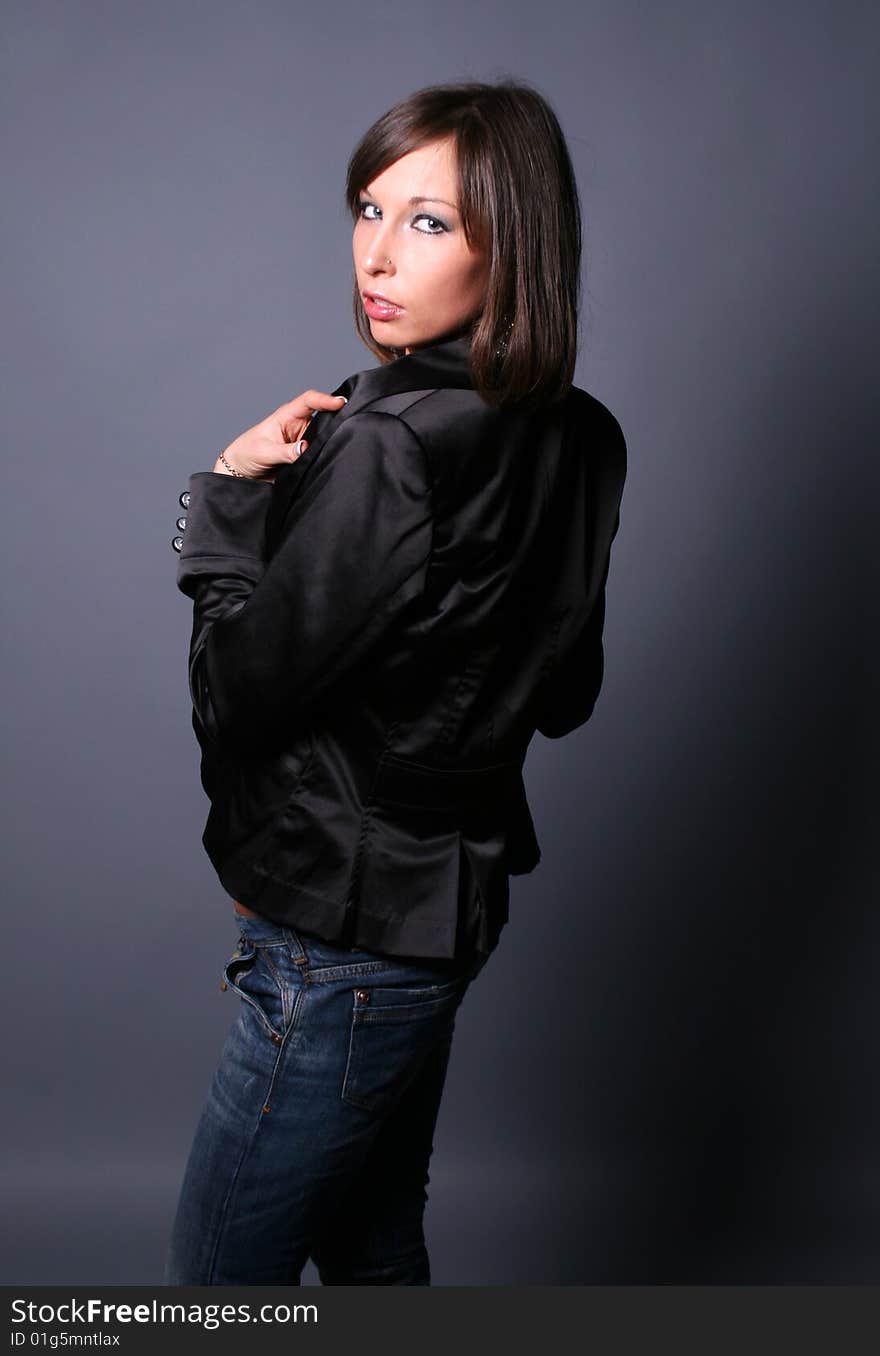 A flirting girl standing in studio