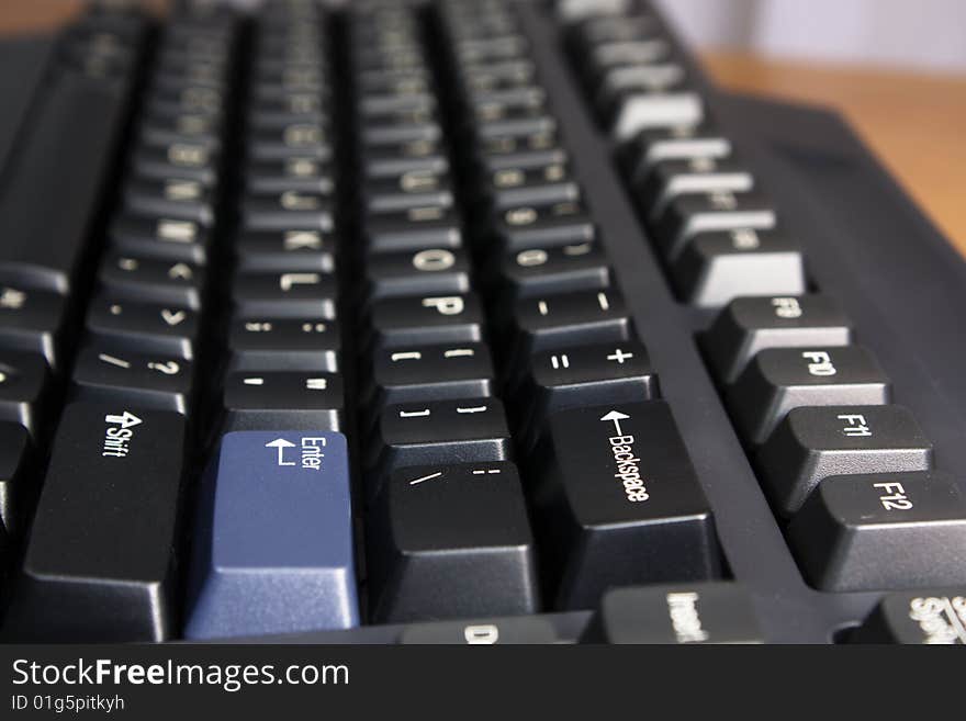 Part of black computer keyboard. Part of black computer keyboard