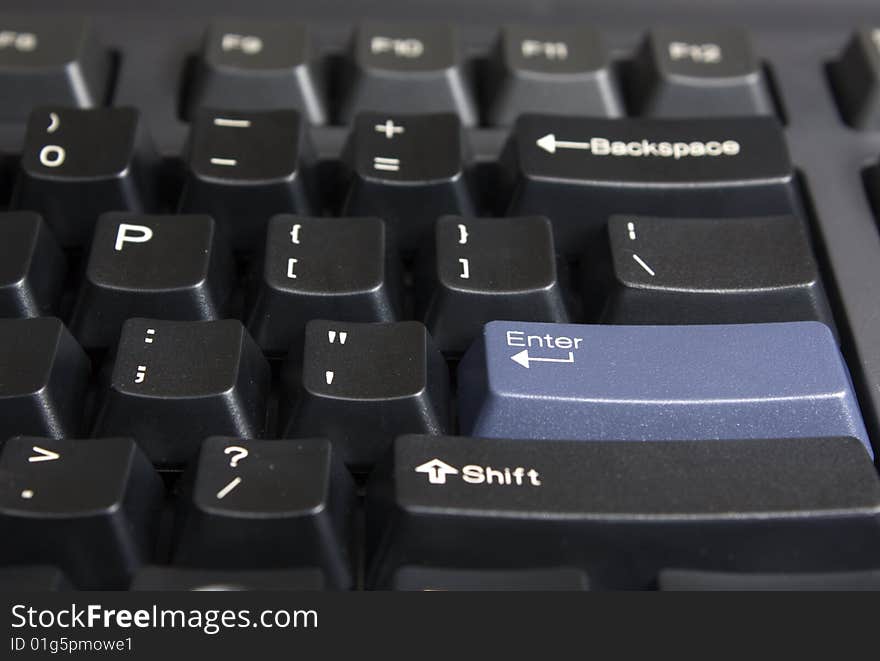 Part of black computer keyboard. Part of black computer keyboard