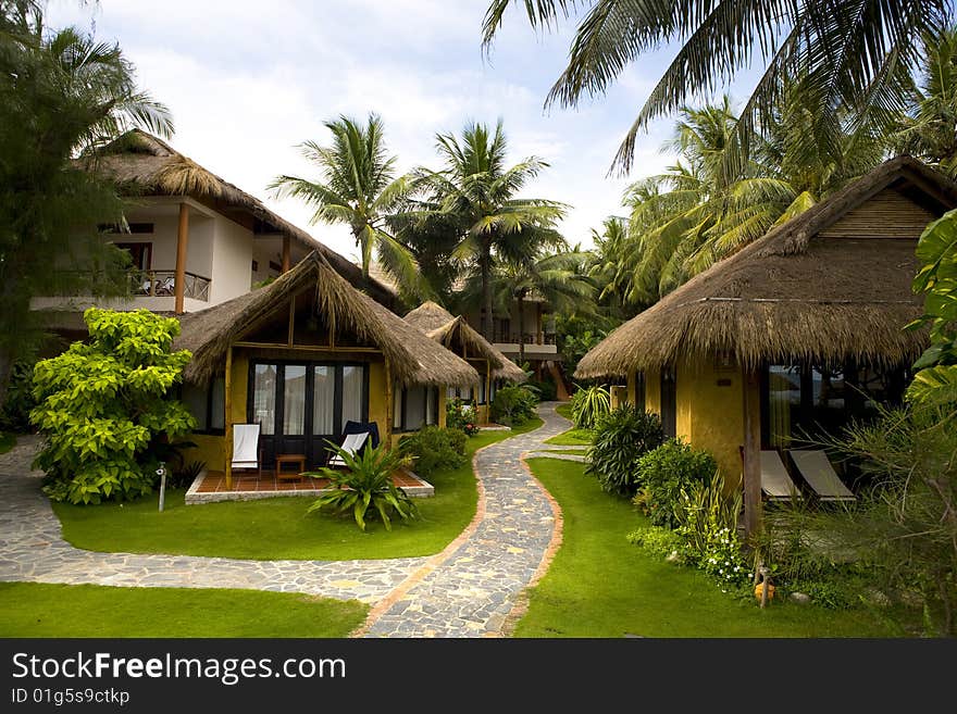 Bungalows of tropical beach resort at sunny day