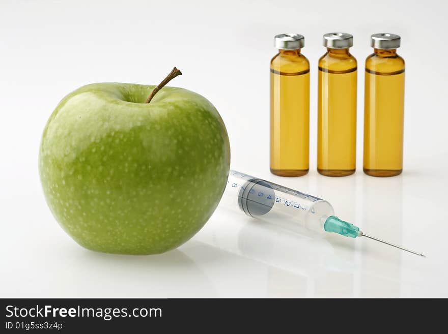 Array of medical apple, drugs and syringe. Array of medical apple, drugs and syringe