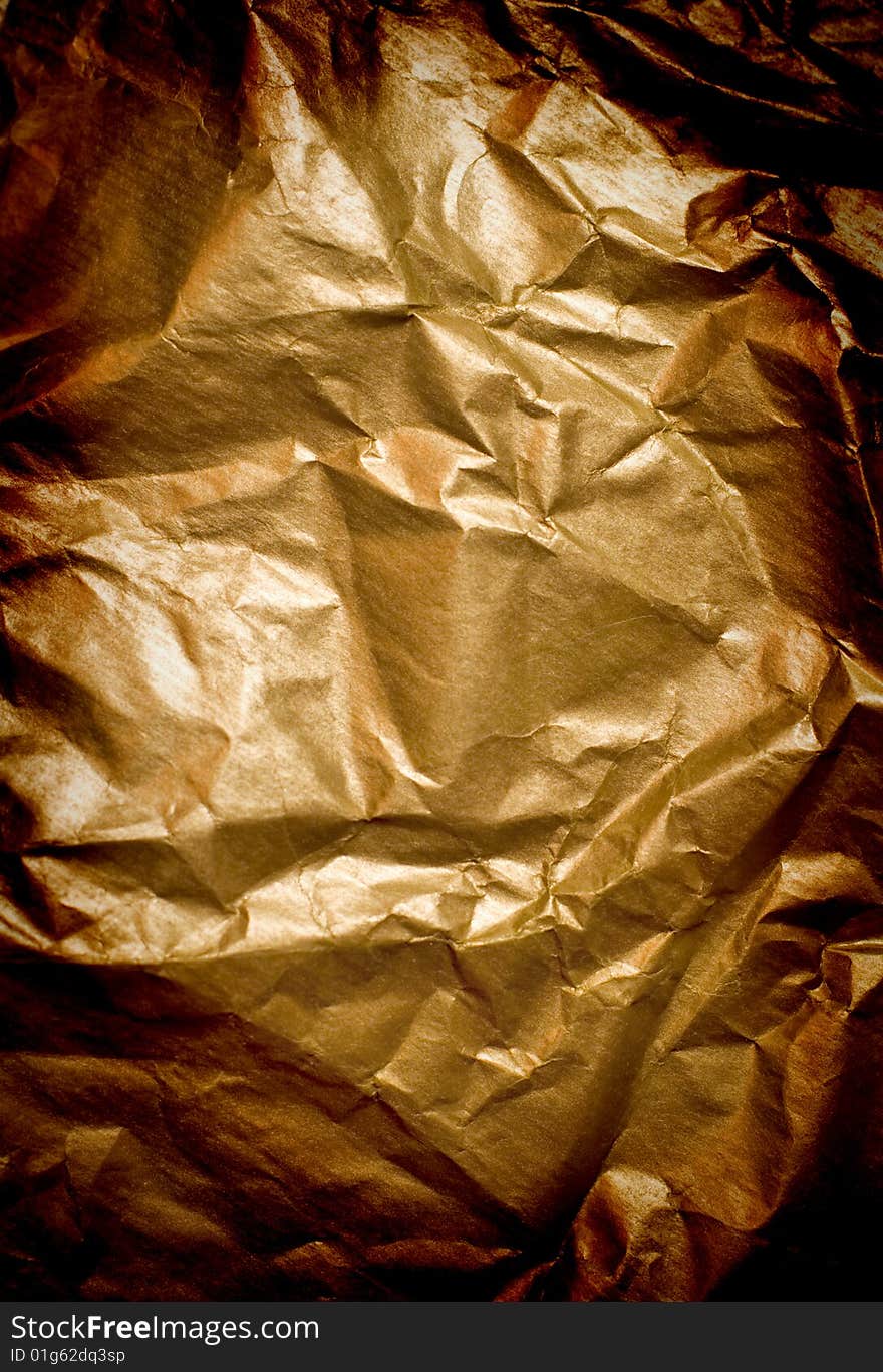 Abstract background of wrinkled golden paper