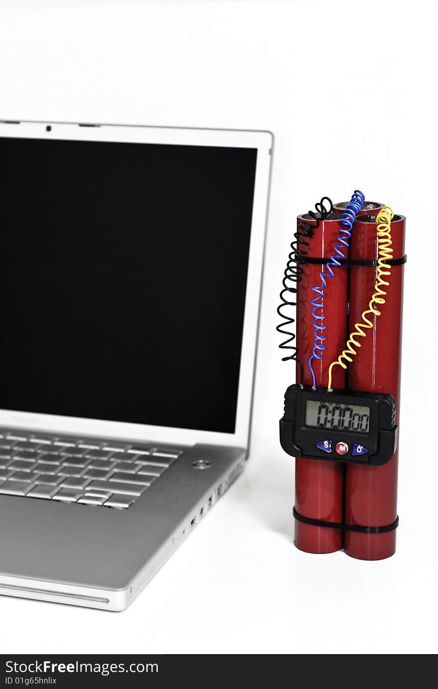 Laptop and red bomb over white background. Laptop and red bomb over white background