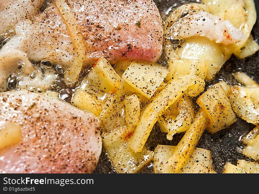 Pangasius filet frying with yellow peppers. Pangasius filet frying with yellow peppers