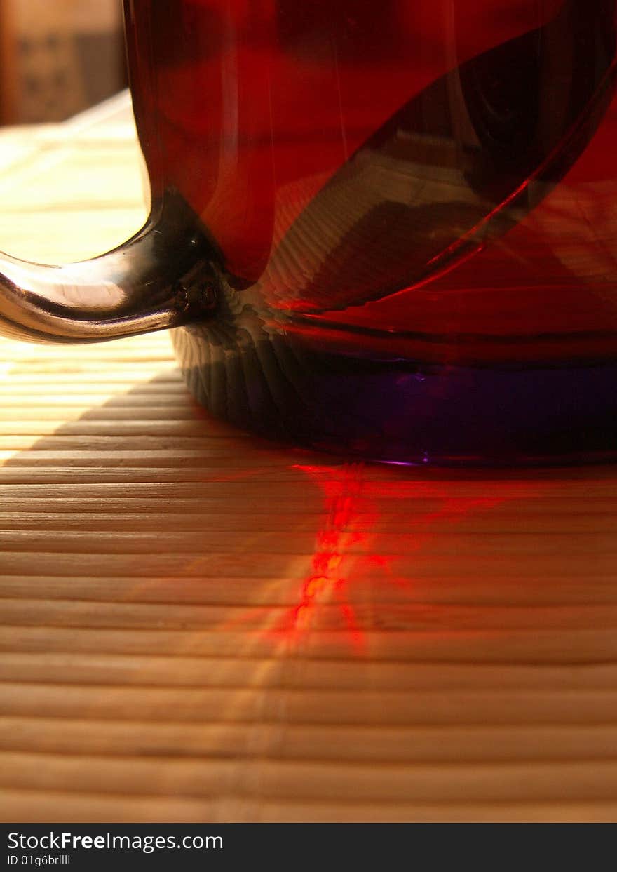 Hot black tea in a transparent glass cup