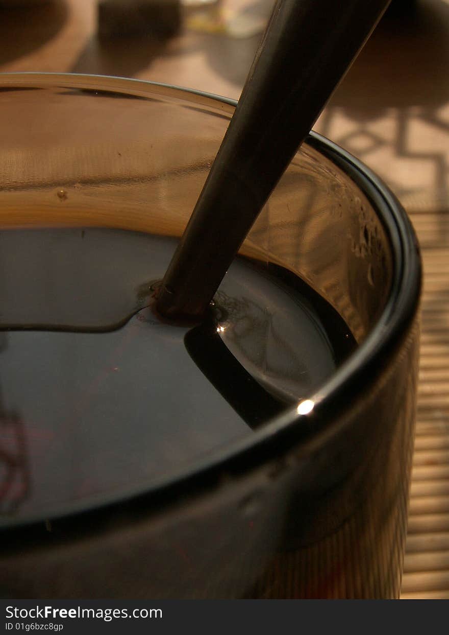 Hot black tea in a transparent glass cup