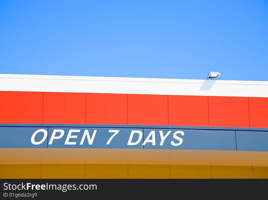 Open 7 days sign on roof of business