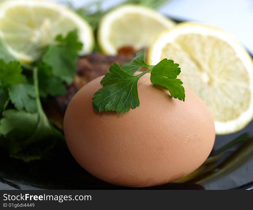 Egg, lemon, parsley on morning meal