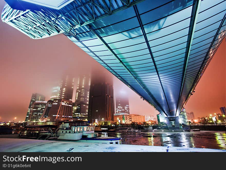 Blue bridge over a river in the evening