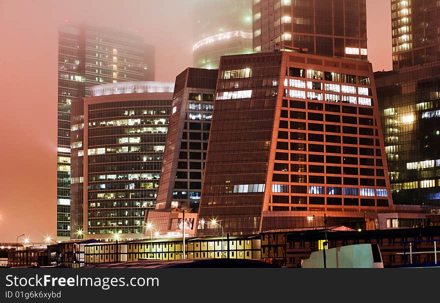 Scyscrapers In Mist At Night