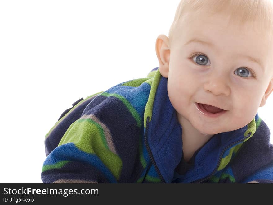 Happily teething baby crawls towards camera while laughing and smiling. Happily teething baby crawls towards camera while laughing and smiling