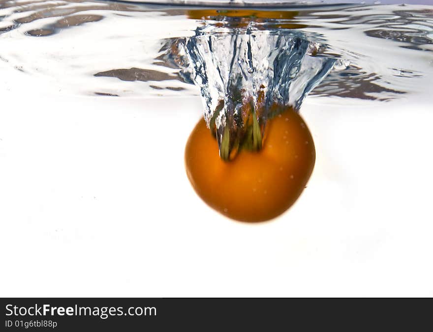 Tomato dropped into water