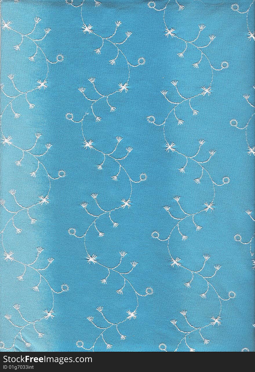 Textile with nuances of blue, embroidered. Textile with nuances of blue, embroidered.