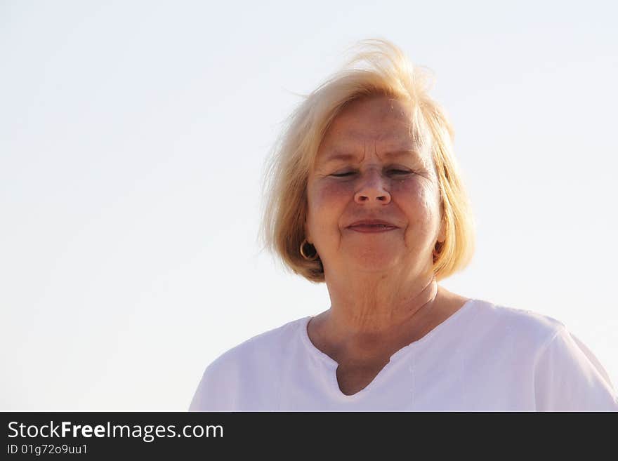 Photo of a happy senior on the beach. Photo of a happy senior on the beach