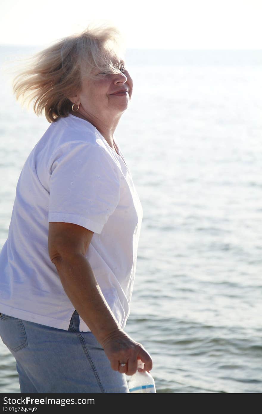 Photo of a happy senior on the beach. Photo of a happy senior on the beach