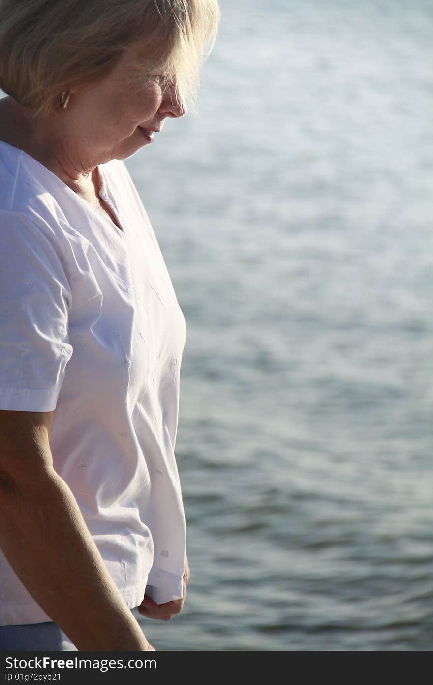 Photo of a happy senior on the beach. Photo of a happy senior on the beach