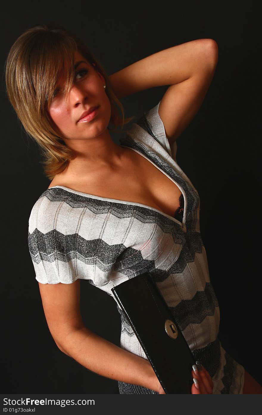 Young and elegant woman in the soft studio light on black background. Young and elegant woman in the soft studio light on black background