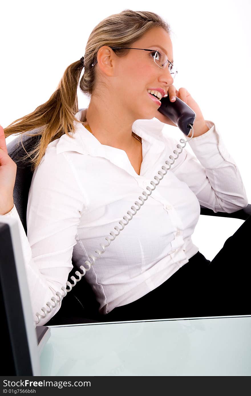 Side view of businesswoman talking on phone  in an office