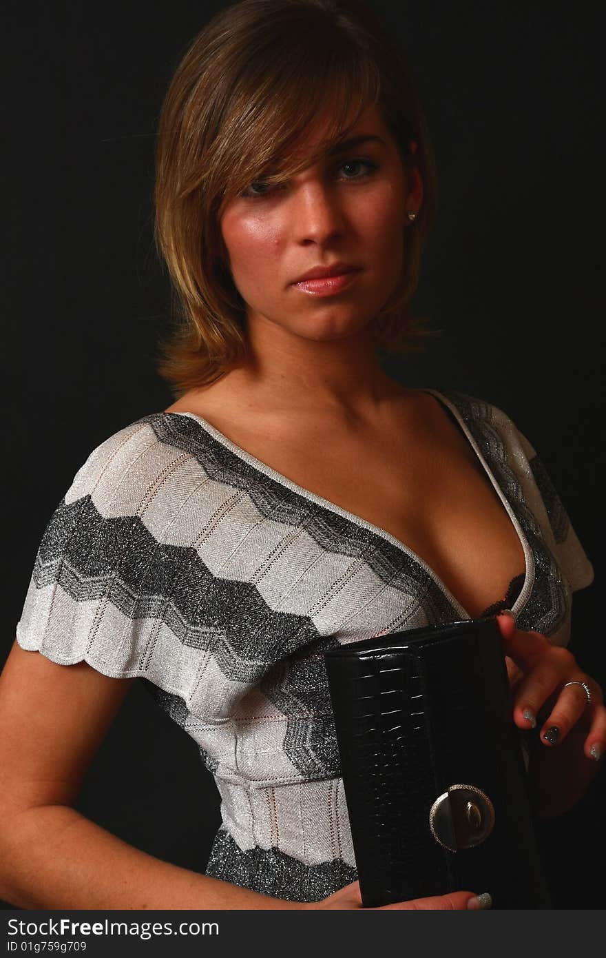 Young and elegant woman in the soft studio light.