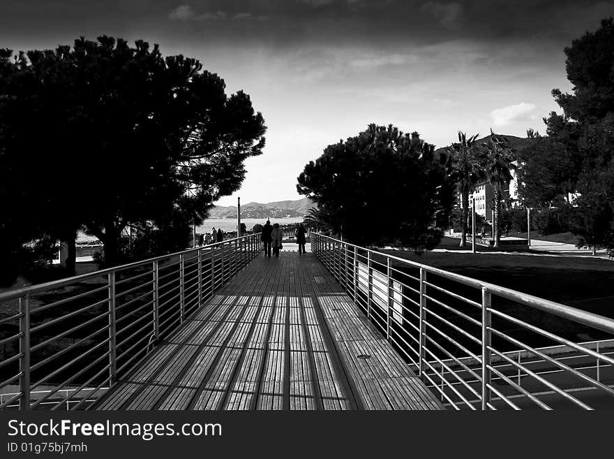 Walk on the sea along a small wooden bridge. Walk on the sea along a small wooden bridge