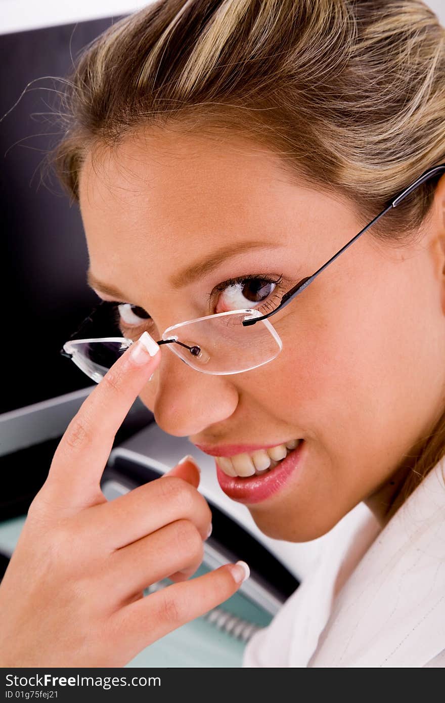 Close view of smiling professional looking at camera in an office