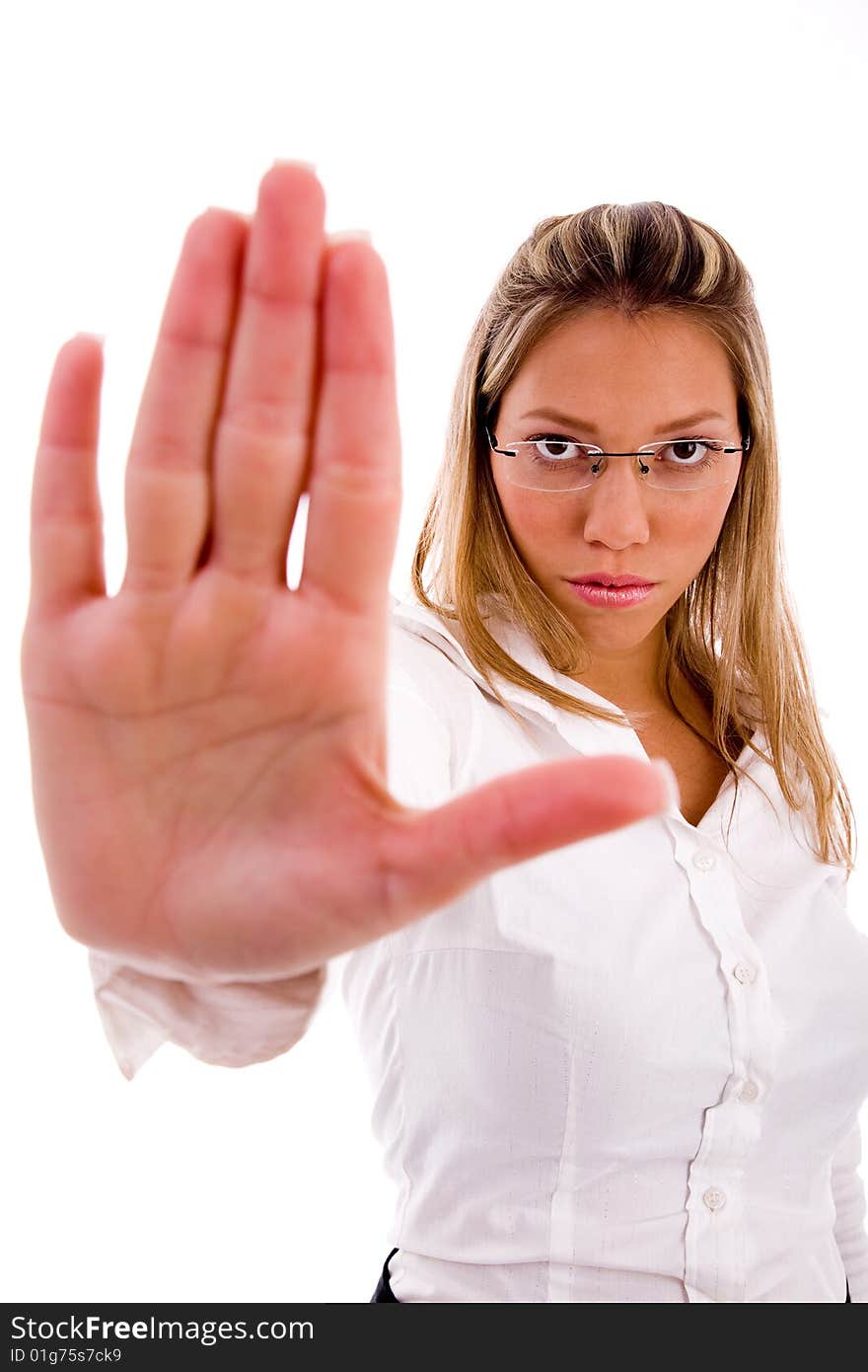 Front view of businesswoman showing stopping gesture on an isolated background