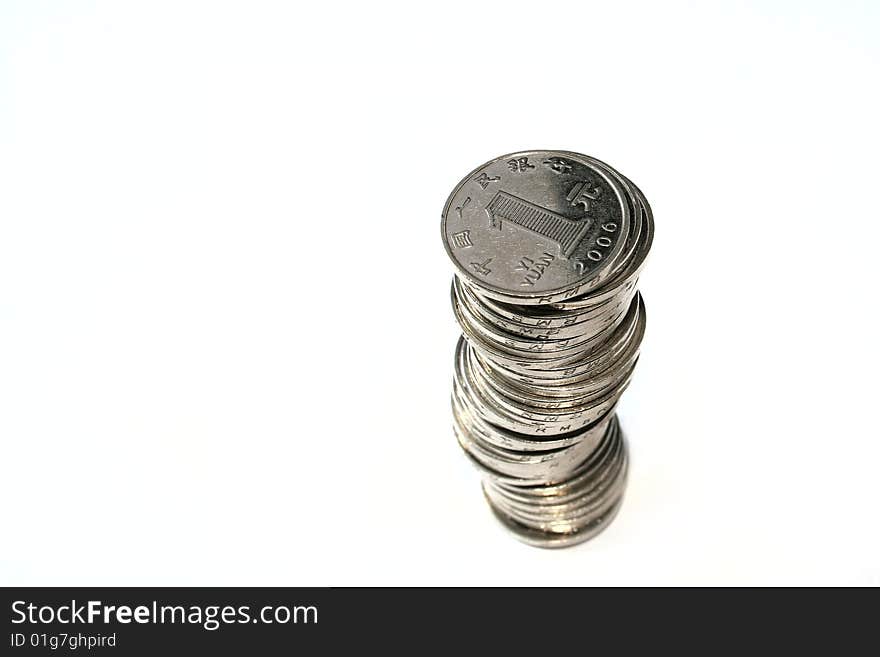 A row of piled coins on white background.