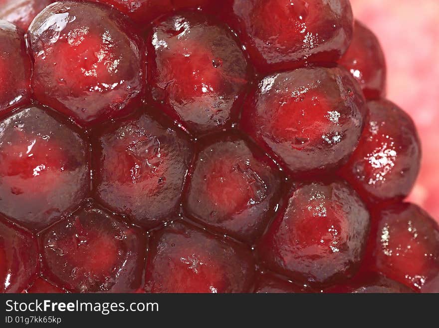 Grains of ripe pomegranate. Fruit.