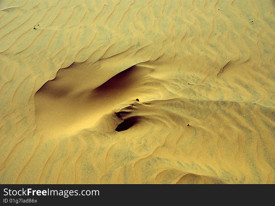 Wind pattern in the sand of dunes. Wind pattern in the sand of dunes