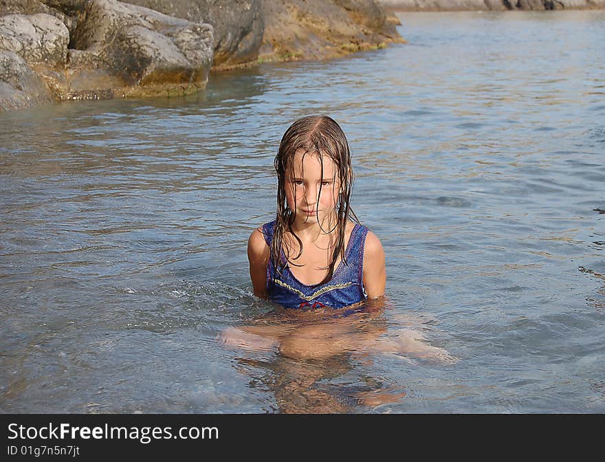 Portrait of girl siting in sea