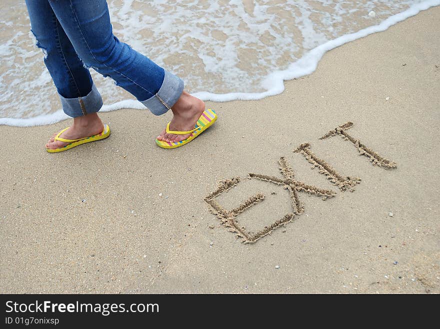 Exit Sign Written in the sandy beach