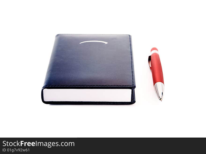 Notepad  with red ballpoint