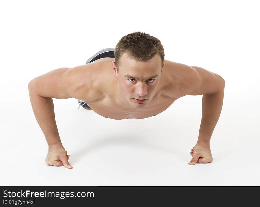 Young man doing push-ups. Young man doing push-ups