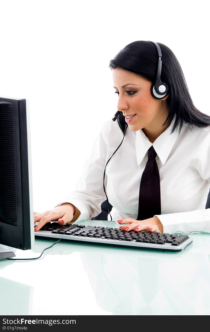 Young executive working on computer on an isolated white background