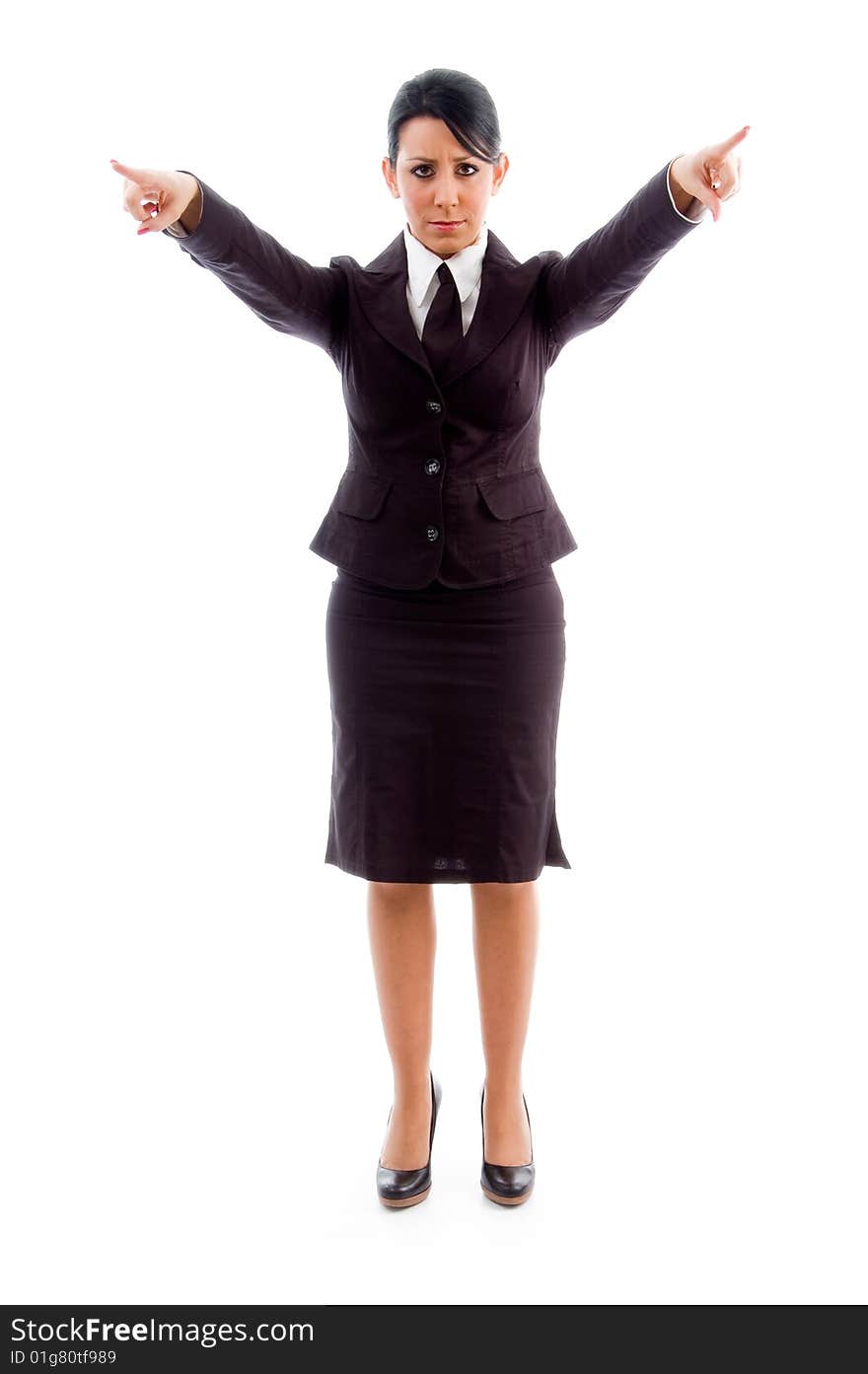 Young businesswoman pointing with both hands against white background