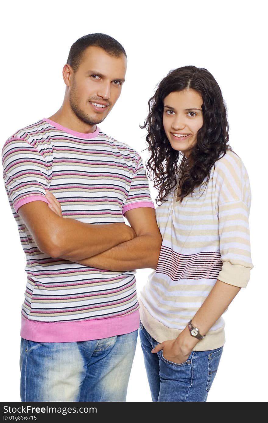 Young happy couple standing, isolated on white