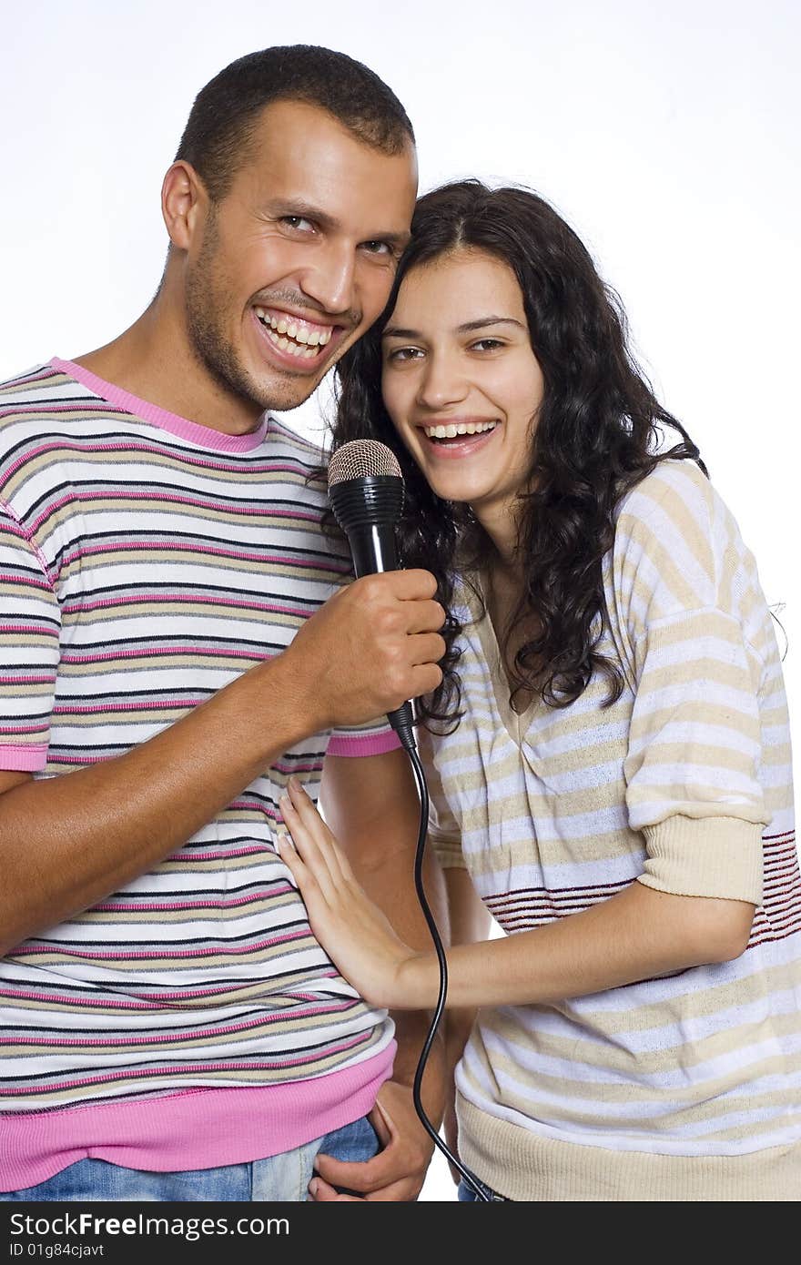 Young happy couple singing isolated on white background