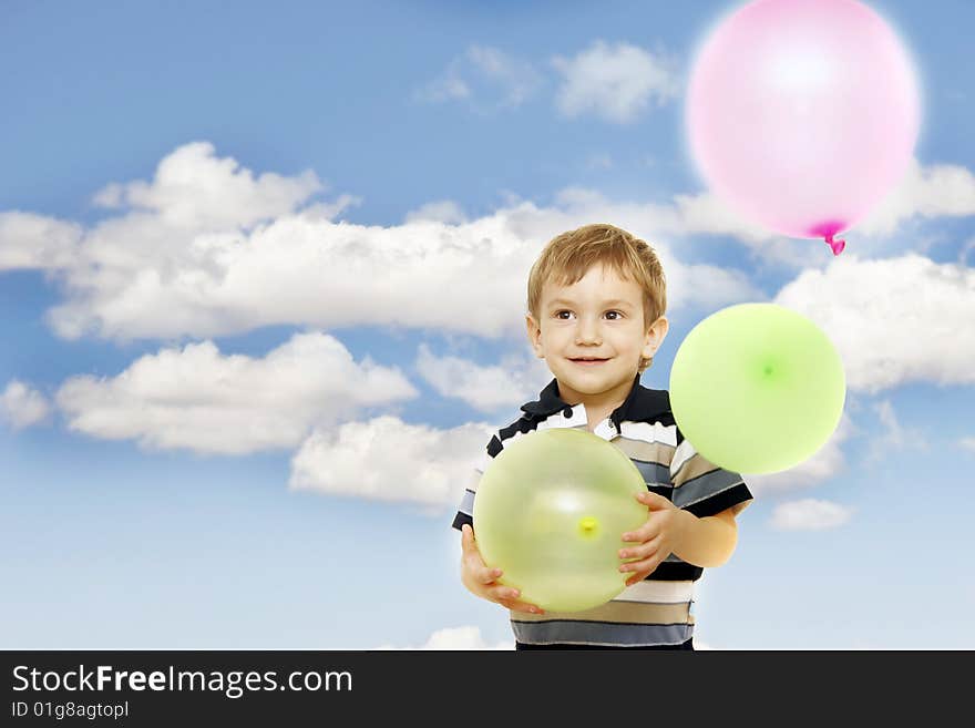 Happy boy with colorful balloons