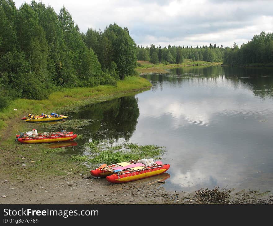 Boats stands beside coast lake before following day