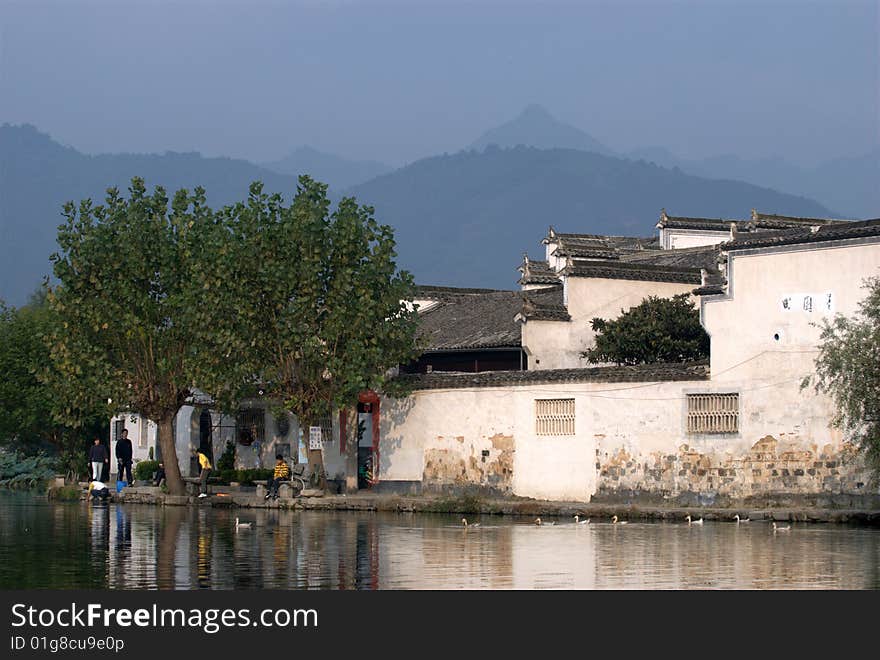 Village lake water people house tree. Village lake water people house tree