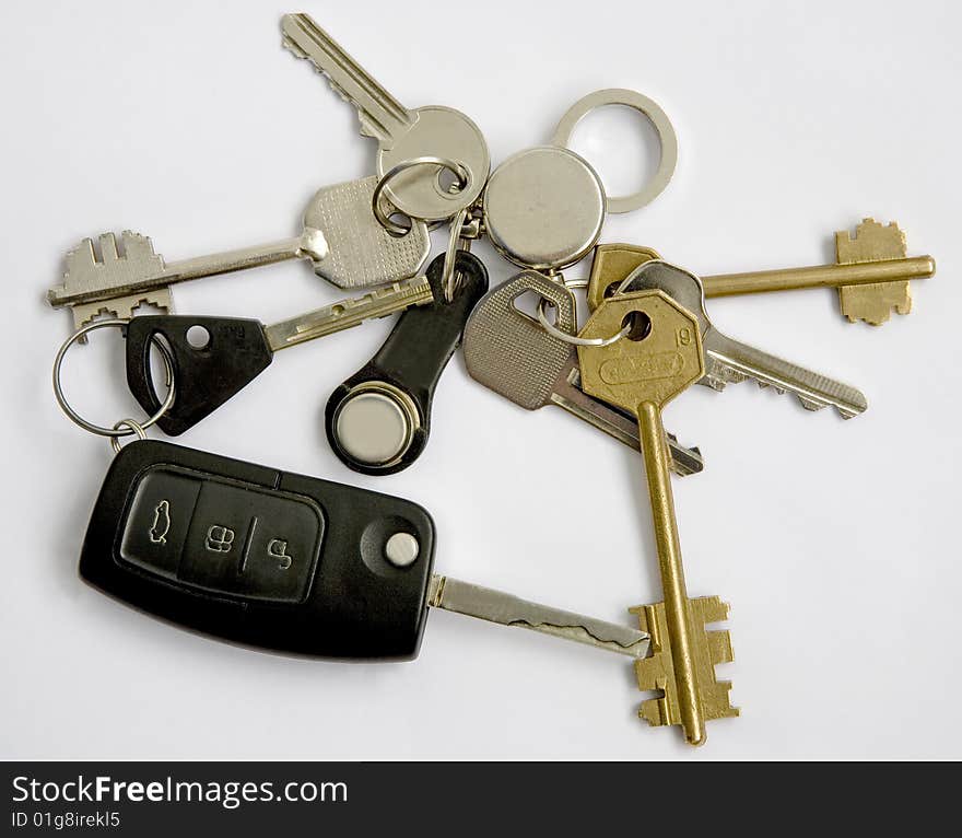 Keys from different doors and the car on a ring. Keys from different doors and the car on a ring