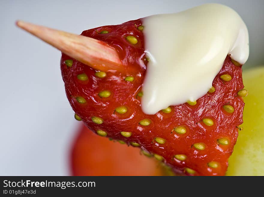 Strawberry with white chocolate cream on stick