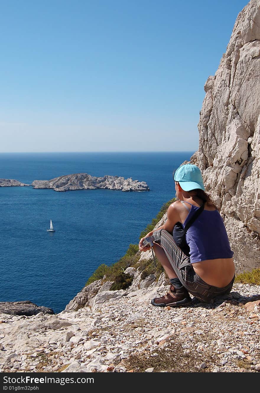 Girl sitting on the seaside