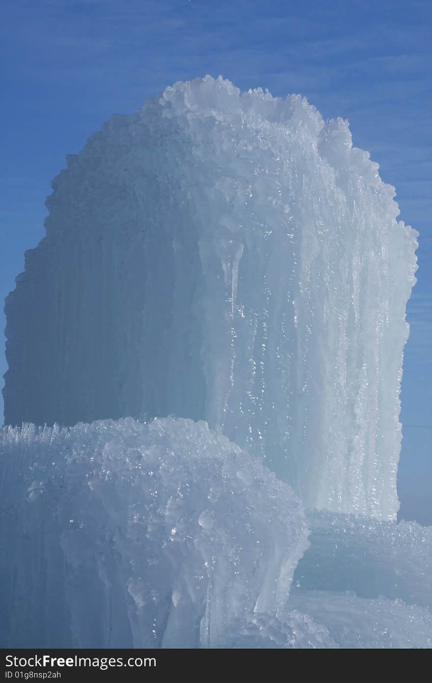 Frozen mass of water on a Blue background